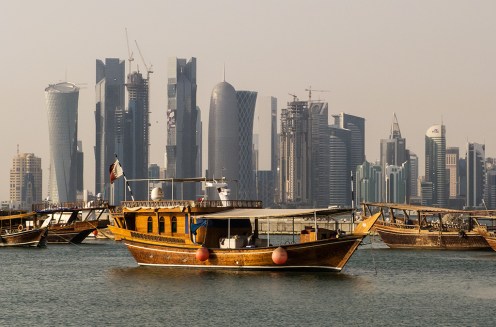 Evening view of the West Bay skyline from the Corniche in Doha, Qatar. Photo by StellarD